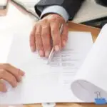 People examining business resume