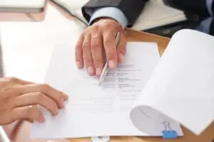 People examining business resume